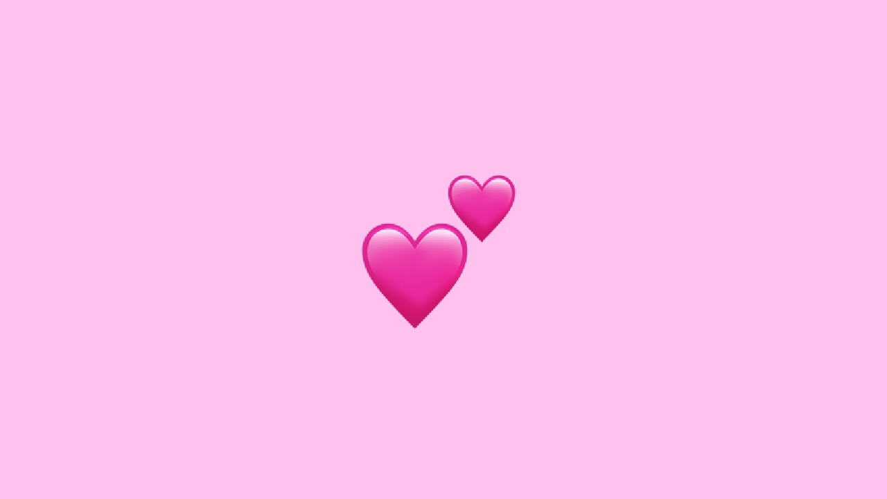 dos emoji de corazón rosa